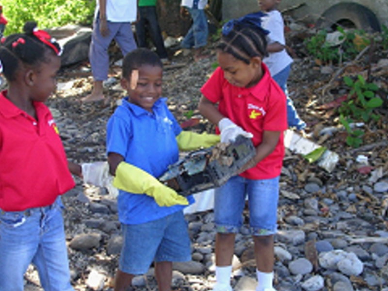 children cleaning the surroundings