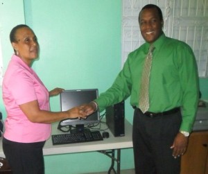 First Domestic Insurance Co. Ltd. donates computer to DAPD