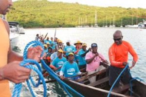 Kalinagos participate in Kanawa crossing