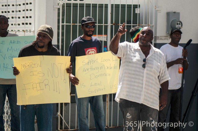 Junior Hart, owner of Collywood, gesticulates during the protest on Monday 