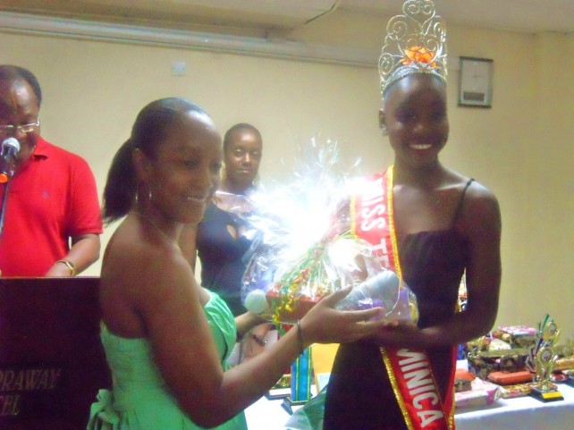 (Picture Caption: Representative of the Waitukubuli Dance Theatre Company presenting the Avon Gift Basket to Miss Teen Dominica 2013)