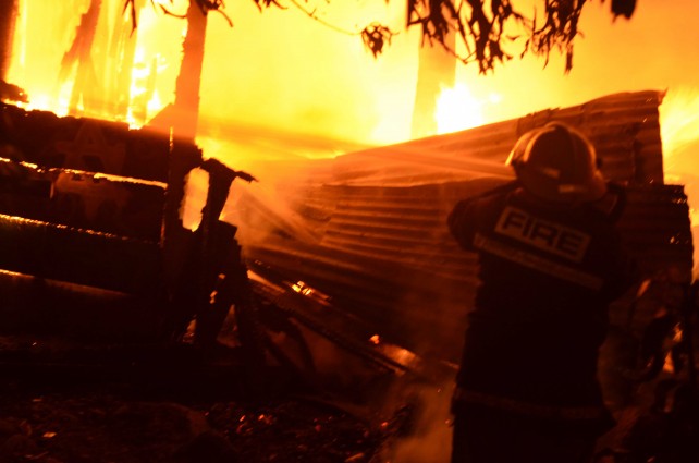 A firefighter battling the blaze
