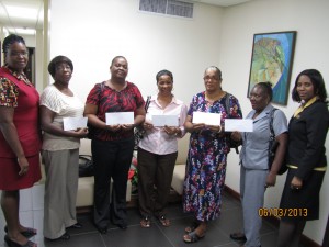 Some of the school principals with their cheques