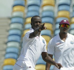 Kemar Roach celebrates the fall of a wicket at the first Windies/Zimbabwe Test in Barbados