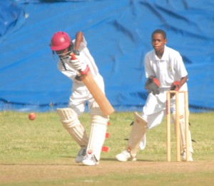 Dominican Lee Liousy is all defense in the closing stages of the nail-biting march in the U-15 last year. Photo by Robertson S. Henry