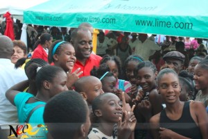 Prime Minister Roosevelt Skerrit poses with young people at the function. Photo by Zaimis Olmos