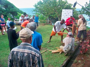 Teams compete in traditional cane squeezing contest at the Kalinago Barana Aute