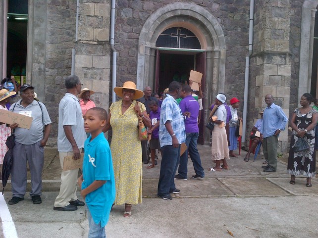 Protesting Grand Bay Catholics outside their church on Sunday
