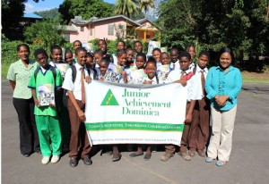 The junior achievers and Natasha Yeeloy Labad, JA executive director in Dominica
