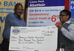 President of the DCA, Emanuel Nanthan receives the donation