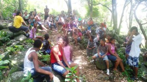 Participants from the camp take a break while on a hike
