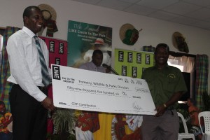 GM of LIME Dominica presents cheque to Forestry, Wildlife & Parks Division