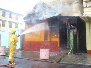 A fire officer battling a blaze in Roseau recently