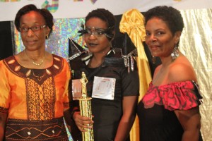 The winner (center) poses with pageant coordinator, Antoinette Mora (right) and DAT president, Celia Nicholas 