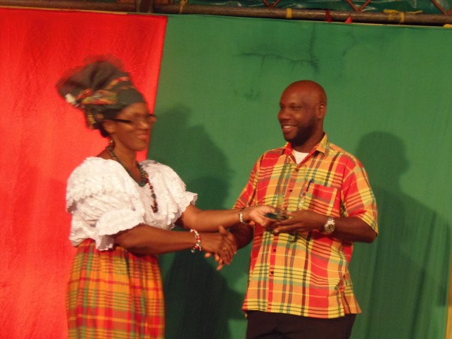 A member of the local  government department received the award from culture minister Justina Charles