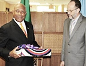 Felix Gregoire presents a token to CARICOM Secretary General on Thursday