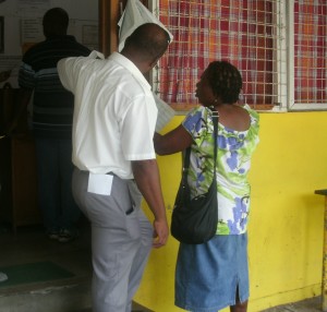 Voters taking a look at the list at a polling station