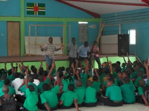 Members of the band with students of the Goodwill Primary School