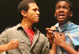 Cadette (left) in his role as 'Brett' about to beat Evan (Montplasir) in the production of '13'