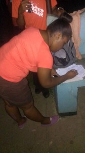 National Youth Council of Dominica First Vice President, Nadege Roach signs petition against Child Abuse