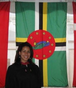 Gamble poses with a flag of Dominica 