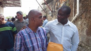Lugay (l) with UWP political leader, Lennox Linton, outside the court house on Thursday