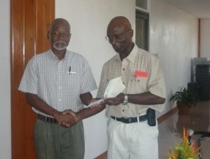 Willie Fevriere receives donation for Education Trust Fund