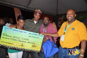 A delighted Anton Joseph (2nd from left) receives his $15,000 prize cheque from NCCU officials