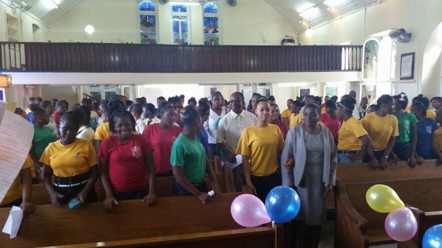 Students in house colours usher in Principal Irish, Mr. Akpa and rest of the staff on Teachers’ Appreciation Day 