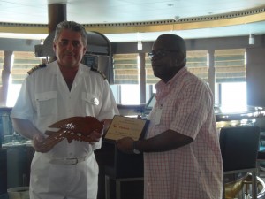 The ship's captain and Bardouille exchange gifts