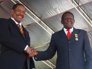 Toussaint shakes hands withe president Savarin