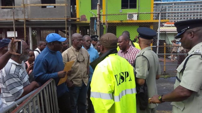 Linton and the delegation talk to police at the port on Monday 