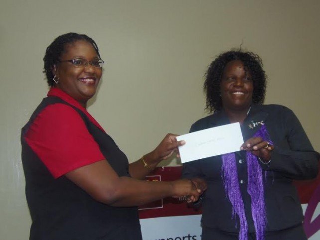 Kathleen Cornelius (right) receives the check from CIBC's Rhonda Lawrence 