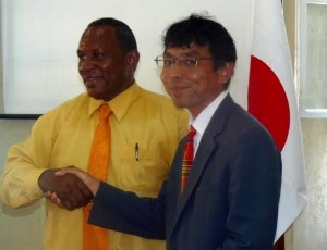 Takafumi Ura of the Japanese embassy shakes hand with DALCA's Yoland Jno Jules