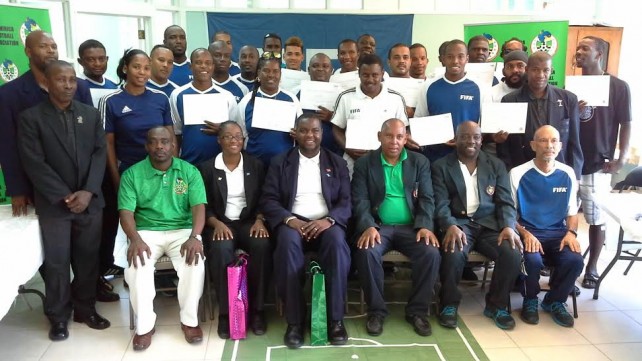 Participants pose with officials after the course 