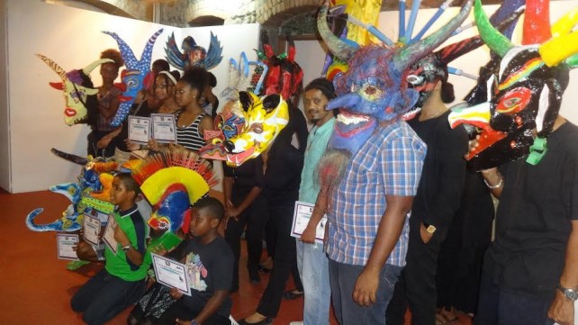Some of the participants and  the masks they made 