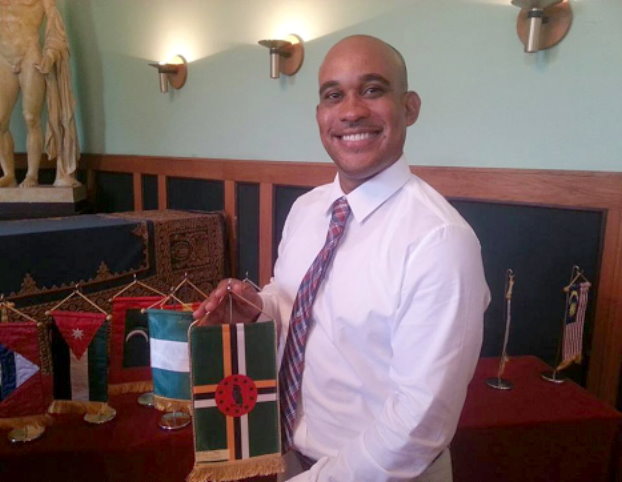Stanton Seraphin proudly holding his Dominican flag after presenting his speech as valedictorian at the Spring 2015 International Coaching Course’s graduation ceremony in Hungary