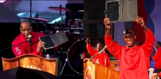 PM Skerrit and Kelvar Darroux showing tablets at a DLP rally last year 