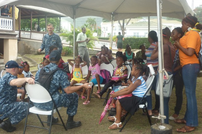 Members of the USNS team engage children at the public library in Roseau