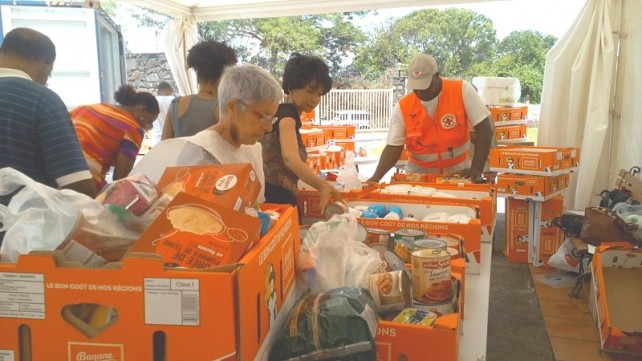 Volunteers from the Martinique Red Cross packing supplies for Dominica 