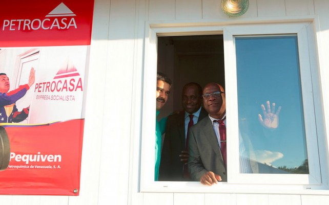 Dr. Harris (right), PM Skerrit and Maduro inspect a petrocasa in Dominica on Wednesday