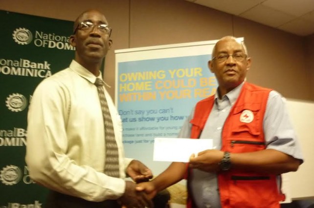Ellington Edwards of NBD presents check to Phillip White of the Red Cross 