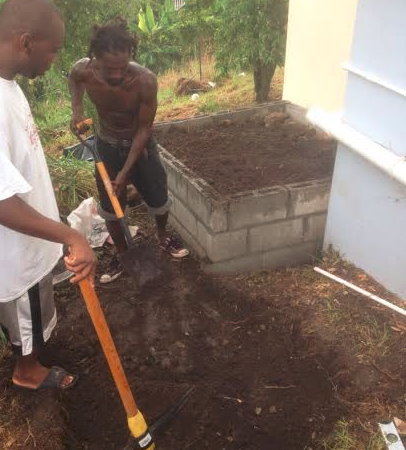 Residents of Salisbury at work to install a water tank in the community 
