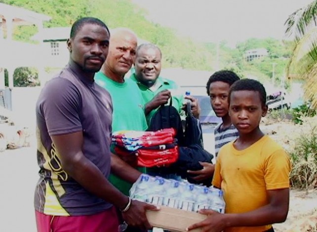 Officials hand over supplies to the two young sportsmen 
