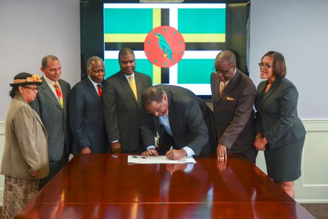 The Dominica relief check being signed 