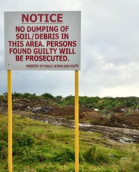 Dumping is being done on the site despite a sign being present 