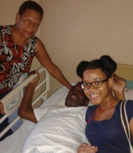 John, his wife and a young lady at a hospital in Martinique