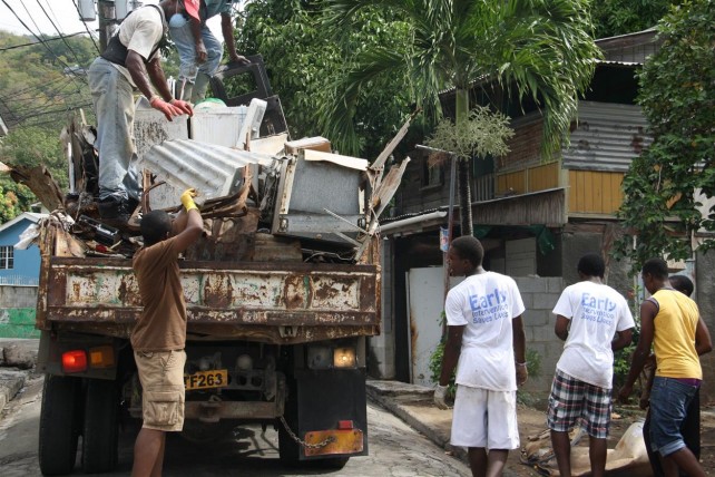 A truck being loaded with waste