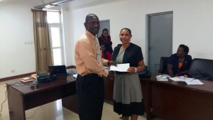 Caribbean students organization makes monetary donation to Ministry of Education