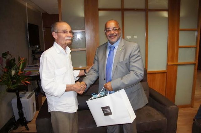 The OECS Director General (left) shakes hands with the President of Executive Council of Martinique 